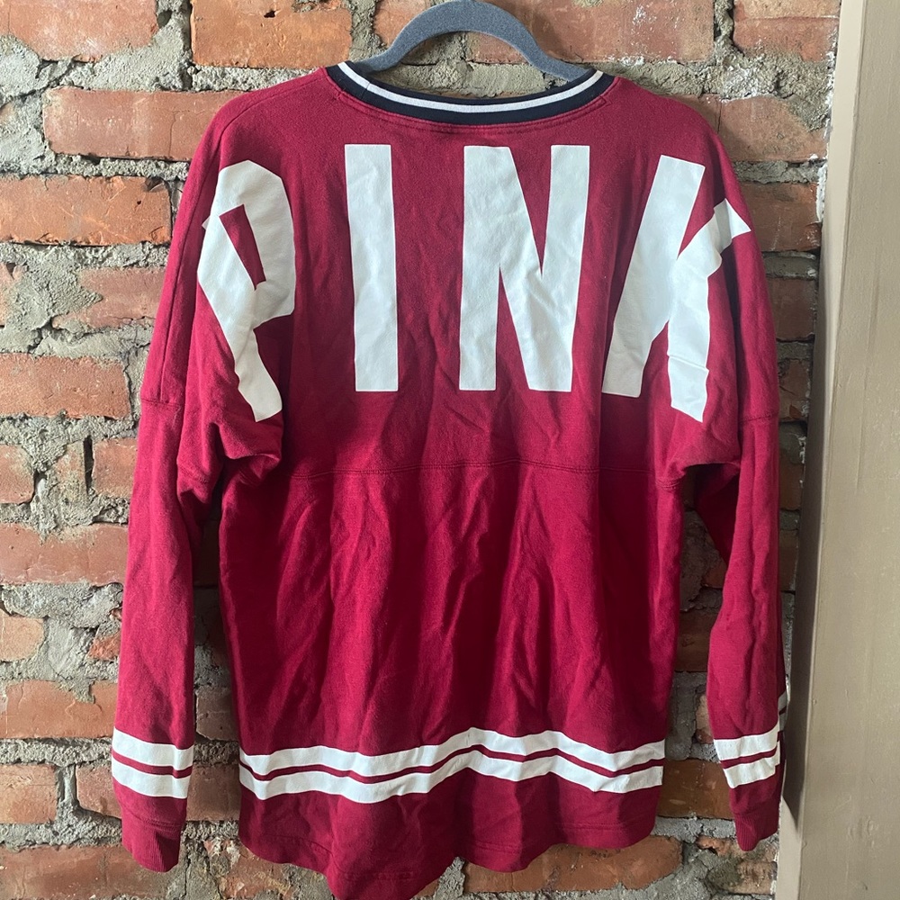 Women’s PINK oversized long sleeve tee, size Medium in ruby red